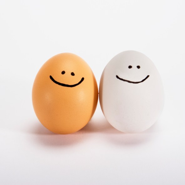 two eggs with smiley faces drawn on them