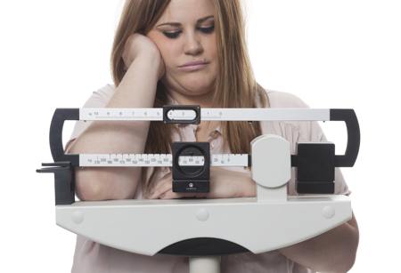 Overweight woman with depressed expression